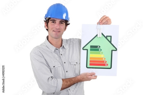 Photo: Laborer showing energy rating sign Laborer showing energy rating sign