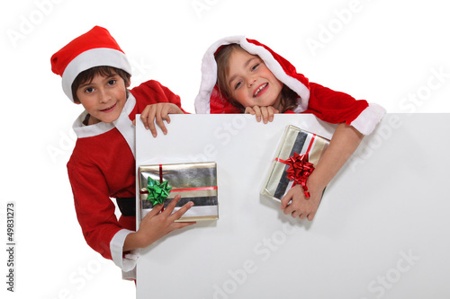 Photo: Children dressed as Santa Claus Children dressed as Santa Claus