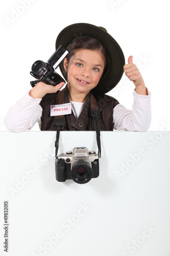 Photo: Young girl pretending to be a correspondent Young girl pretending to be a correspondent