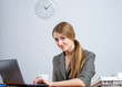 Young female executive working on laptop