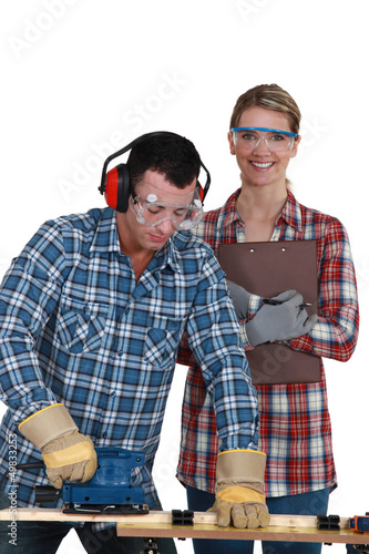 Photo: male and female joiners working together male and female joiners working together