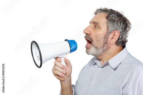 Photo: An elderly man says something into a megaphone An elderly man says something into a megaphone
