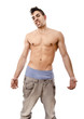 Arrogant fitness boy, in jeans.