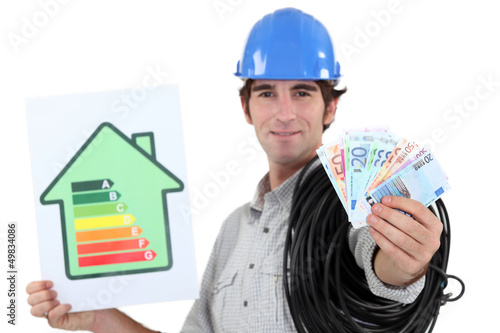 Photo: electrician showing banknotes electrician showing banknotes
