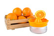 orange fruits in a wooden crate isolated on white background