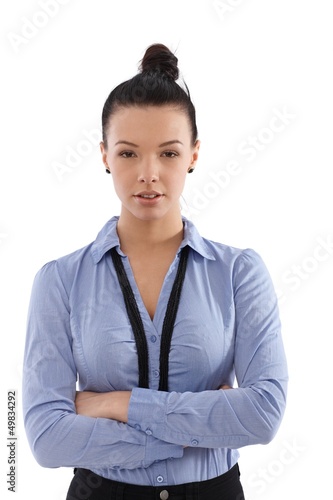 Photo: Confident businesswoman standing arms crossed Confident businesswoman standing arms crossed
