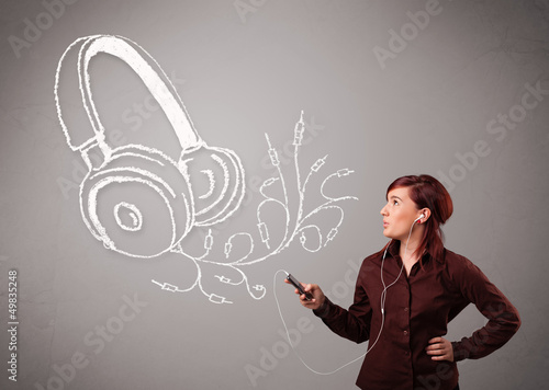 Photo: young woman singing and listening to music with abstract headpho young woman singing and listening to music with abstract headpho