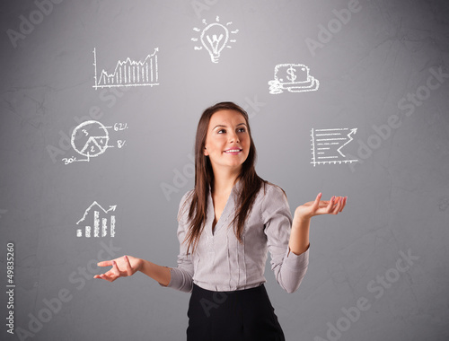 Photo: beautiful young woman juggling with statistics and graphs beautiful young woman juggling with statistics and graphs
