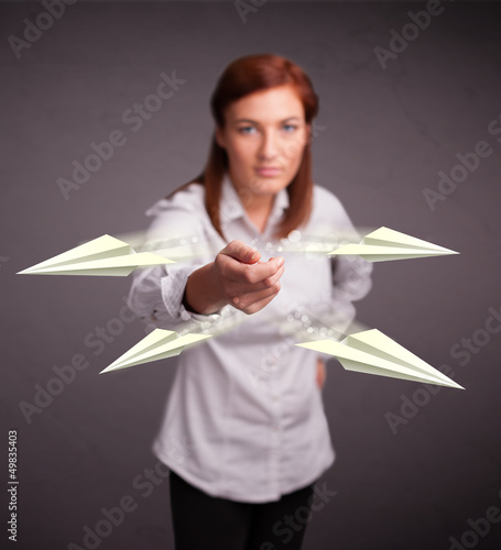 Photo: Beautiful lady throwing origami airplanes Beautiful lady throwing origami airplanes