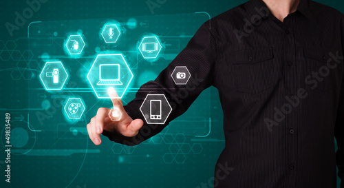 Photo: Businessman pressing virtual media type of buttons Businessman pressing virtual media type of buttons