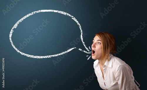Photo: Young woman with modern speech bubble Young woman with modern speech bubble