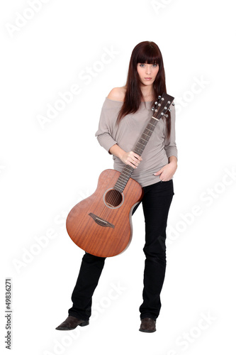 Photo: Woman posing with her guitar Woman posing with her guitar