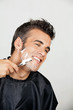 Happy Man Shaving His Face
