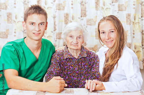 Photo: Elderly woman with the young doctor Elderly woman with the young doctor