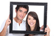 Teenagers holding photo frame