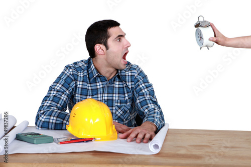 Photo: Shocked man looking at the time Shocked man looking at the time