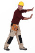 Construction worker pushing empty copyspace