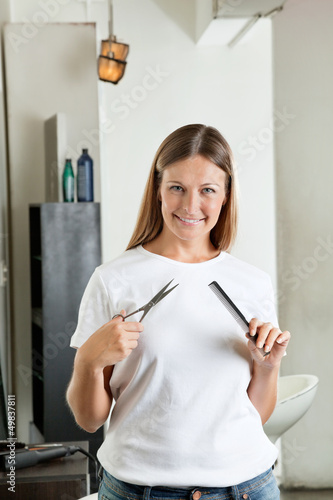 Photo: Hairdresser Holding Comb And Scissors Hairdresser Holding Comb And Scissors