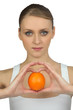 Woman holding an orange