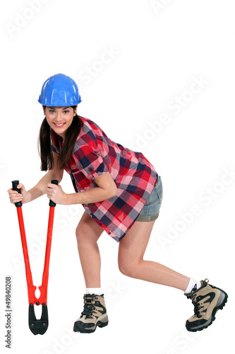 Photo: Female construction worker with boltcutters Female construction worker with boltcutters