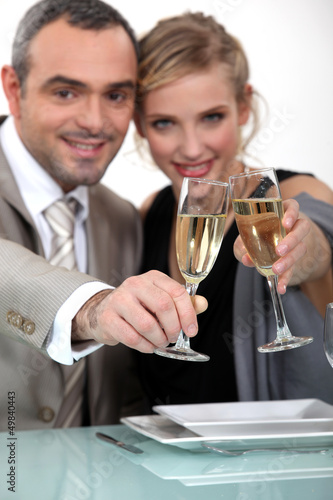 Photo: Couple toasting with champagne Couple toasting with champagne