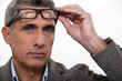 Man raising his glasses
