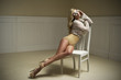 Young sexy woman on chair.