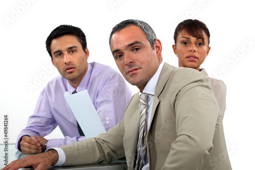 Photo: A team of business professionals having a meeting A team of business professionals having a meeting