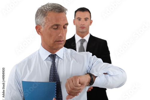 Photo: Two businessmen rushing to meet dead-line Two businessmen rushing to meet dead-line