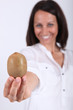 Woman holding a kiwi