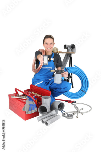 Photo: woman plumber with phone woman plumber with phone