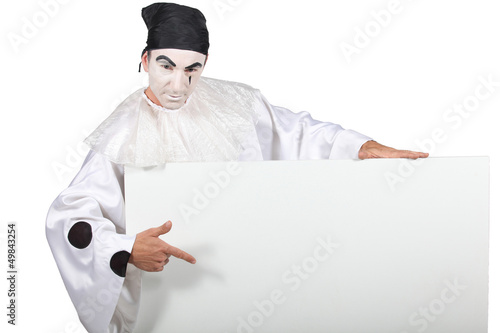 Photo: Clown pointing at sign Clown pointing at sign