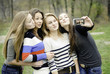 Photo: Four teen girls taking picture of themselves Four teen girls taking picture of themselves