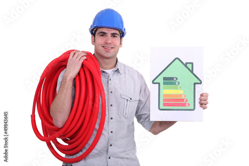 Photo: craftsman holding an energy consumption label craftsman holding an energy consumption label