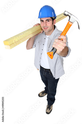 Photo: Man holding hammer Man holding hammer