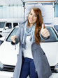 Customer is satisfied with the car service shows thumb up