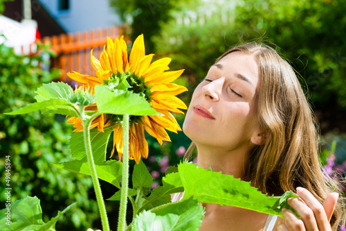 Photo: Woman standing in the garden Woman standing in the garden