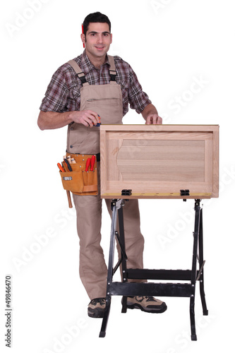 Photo: woodworker making a window woodworker making a window