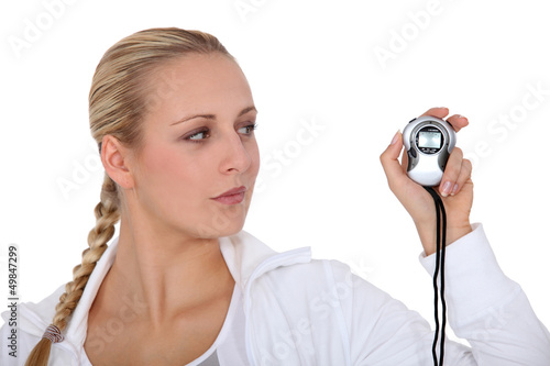 Photo: Woman with timer Woman with timer