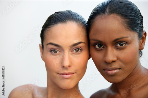 Photo: Two beautiful Caucasian and African women Two beautiful Caucasian and African women