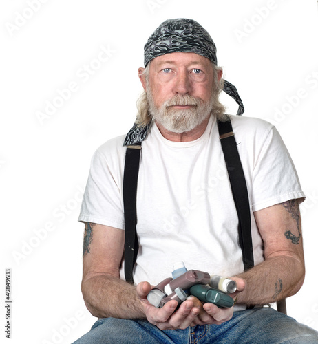 Photo: Strong man with a handful of breathing medications Strong man with a handful of breathing medications