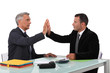 business partners sitting at table