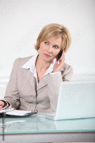 Photo: Executive secretary at her desk Executive secretary at her desk