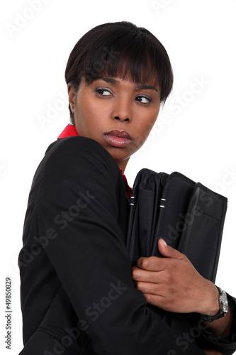 Photo: Nervous businesswoman has something to hide Nervous businesswoman has something to hide