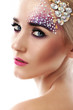 Closeup portrait of beautiful woman with artistic makeup