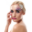 Closeup portrait of beautiful woman with artistic makeup