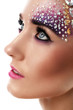 Closeup portrait of beautiful woman with artistic makeup