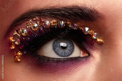 Photo: Closeup image of eye with artistic makeup Closeup image of eye with artistic makeup