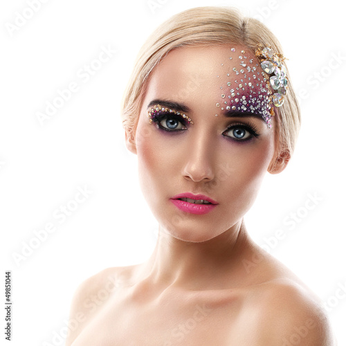 Photo: Closeup portrait of beautiful woman with artistic makeup Closeup portrait of beautiful woman with artistic makeup