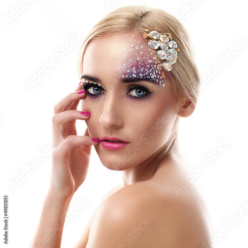 Photo: Closeup portrait of beautiful woman with artistic makeup Closeup portrait of beautiful woman with artistic makeup